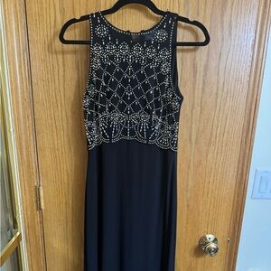 Elegant Black Sleeveless Dress with Silver Accents